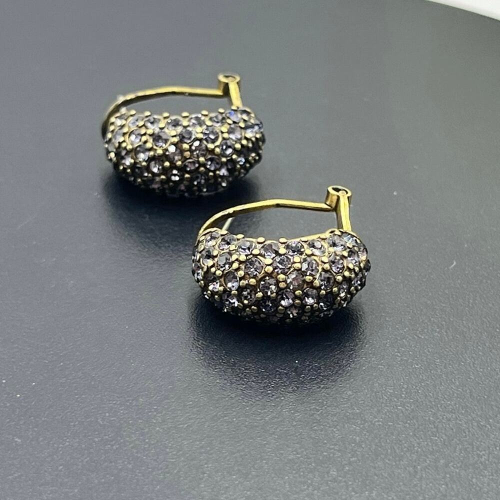 Heidi Daus "Hugs from Heidi" Crystal Half-Hoop Earrings in a violet crystal pavé